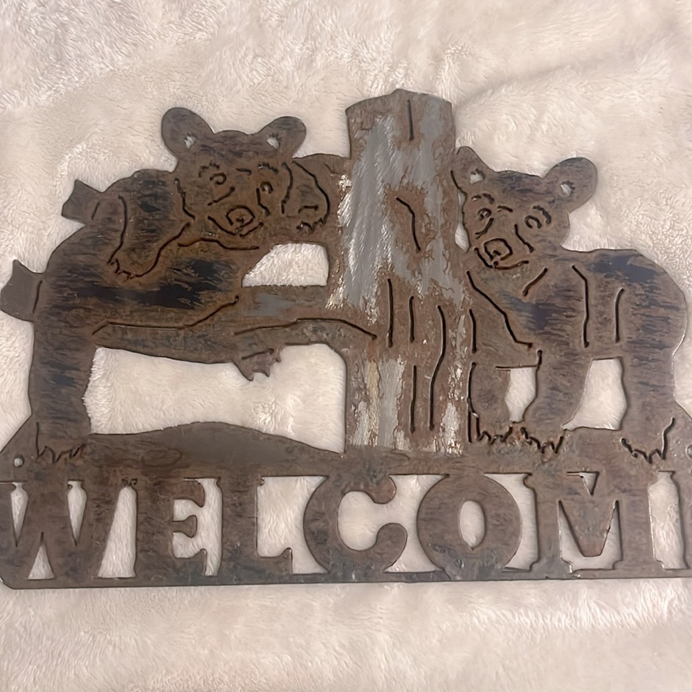 Brass Two bears Welcome sign